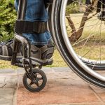 Wheelchair-user on path in park